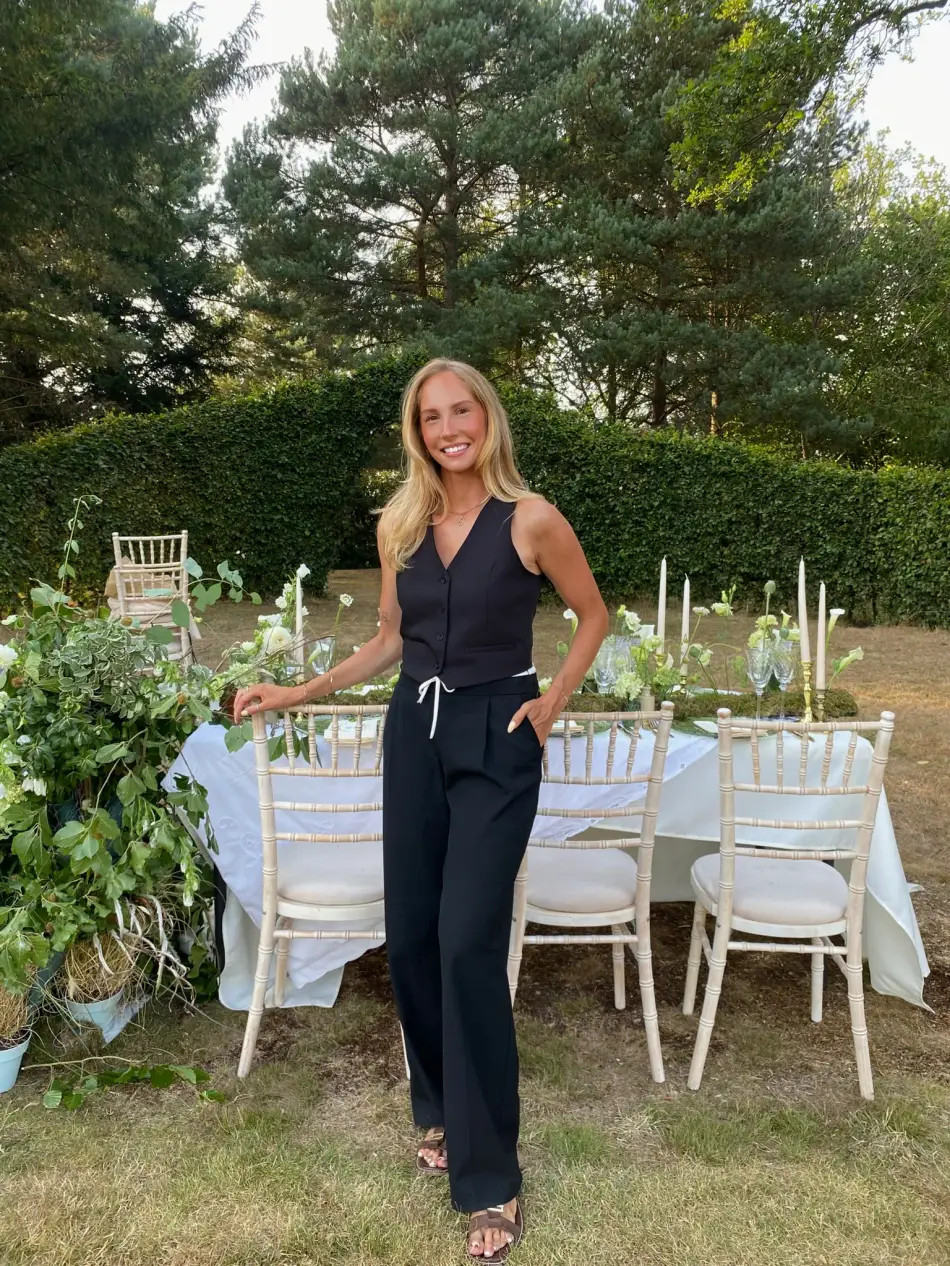 Charley, founder of CG Wedding Events, at a styled wedding table setting