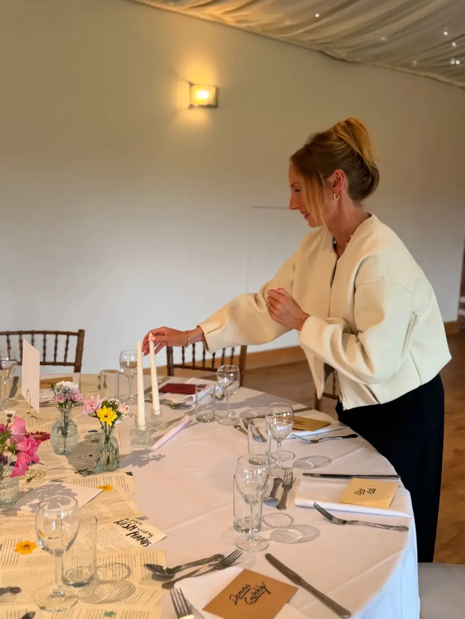 Charley, wedding stylist, arranging table styling details