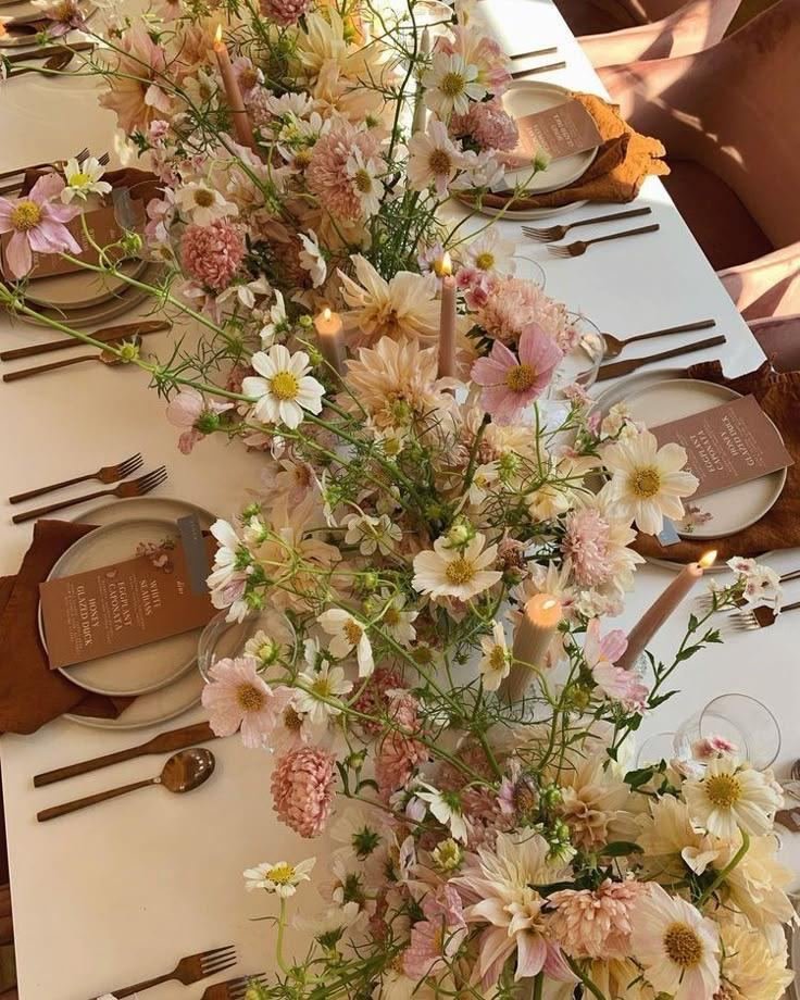 Peach candles and wildflower arrangements